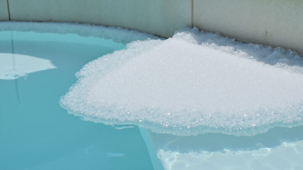 stop pool water foaming fast